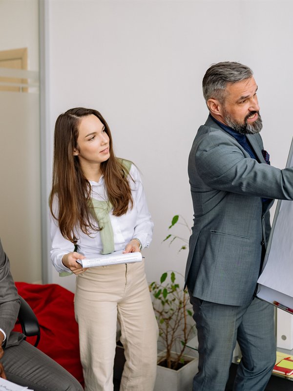Trainer leading a session at a flipchart